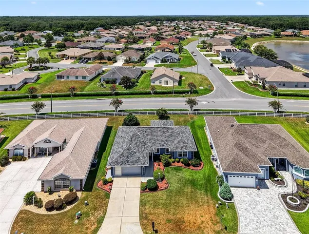 an aerial view of houses with outdoor space