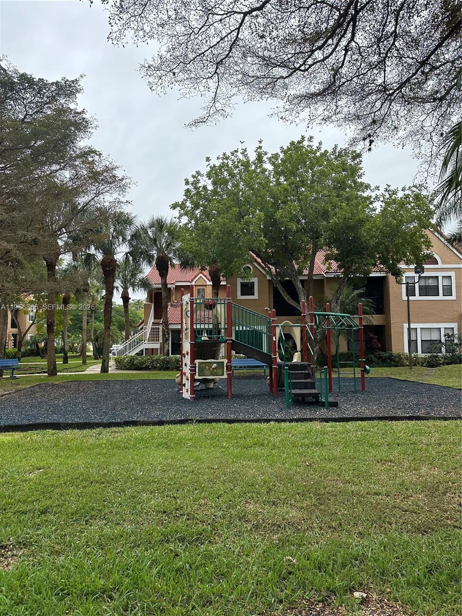 15560 Southwest 104th Terrace, Unit 625 Miami, FL 33196 - Photo 1 of 14 a view of a park with slide