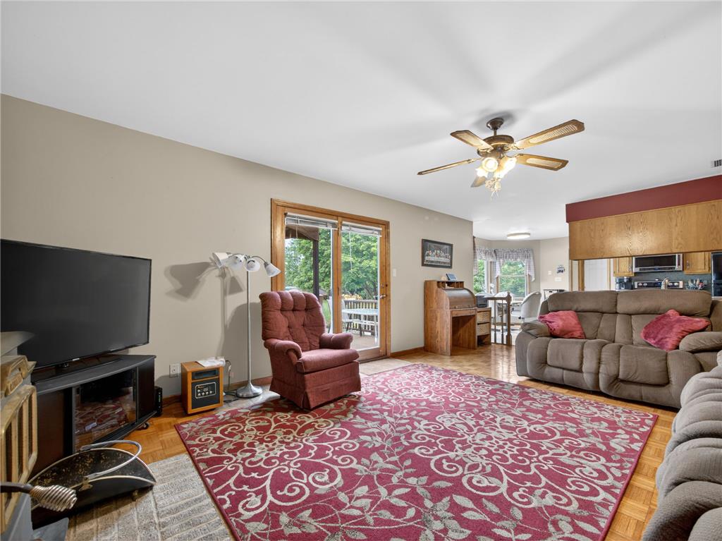 853 Lahr Road Nazareth, PA 18064 - Photo 8 of 29 Hardwood floors and a welcoming ceiling fan complement this comfortable living space with outdoor access.