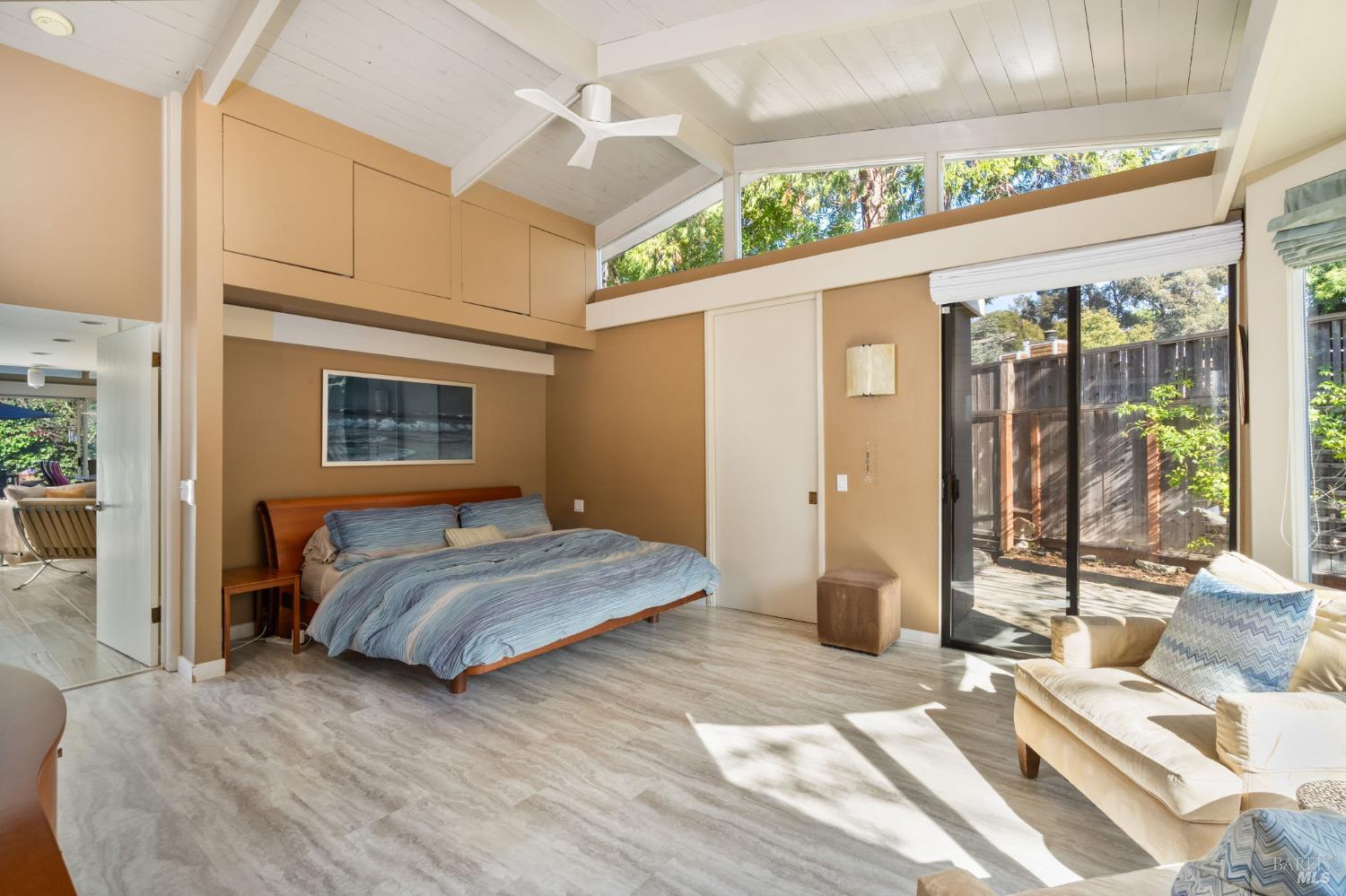 43 La Crescenta Way San Rafael, CA 94901 - Photo 16 of 28 a bedroom with a bed mirror and windows