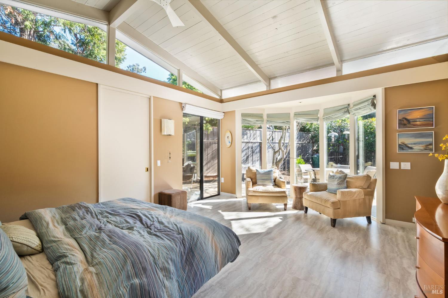 43 La Crescenta Way San Rafael, CA 94901 - Photo 17 of 28 a bedroom with furniture and large windows
