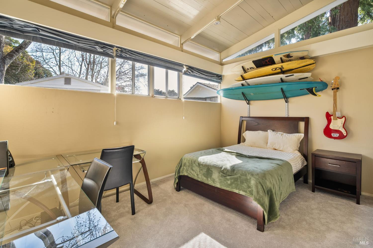43 La Crescenta Way San Rafael, CA 94901 - Photo 20 of 28 a bedroom with a bed a chair and potted plant