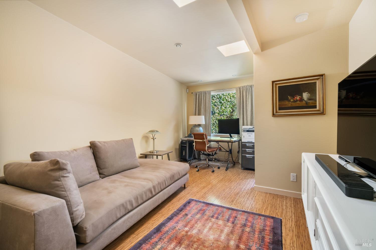 43 La Crescenta Way San Rafael, CA 94901 - Photo 23 of 28 a living room with furniture and a wooden floor