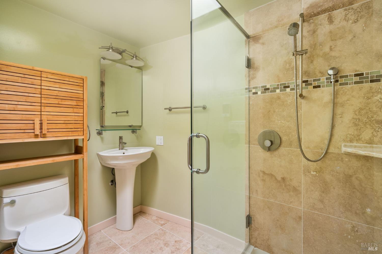 43 La Crescenta Way San Rafael, CA 94901 - Photo 24 of 28 a bathroom with a shower sink mirror and toilet