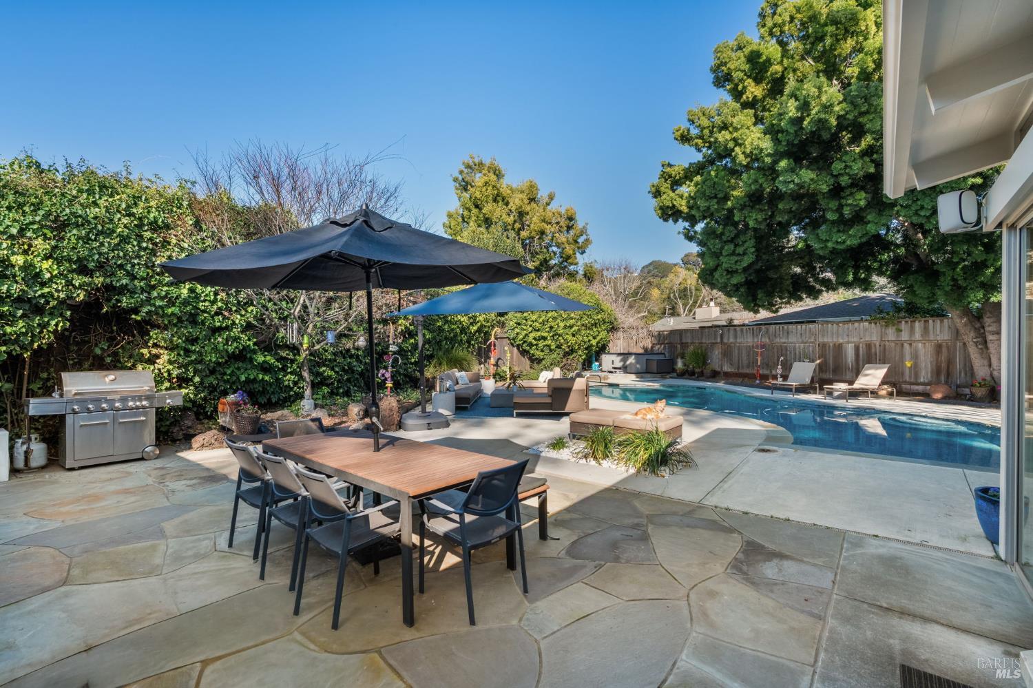 43 La Crescenta Way San Rafael, CA 94901 - Photo 26 of 28 a view of a dinning table and chairs in the patio