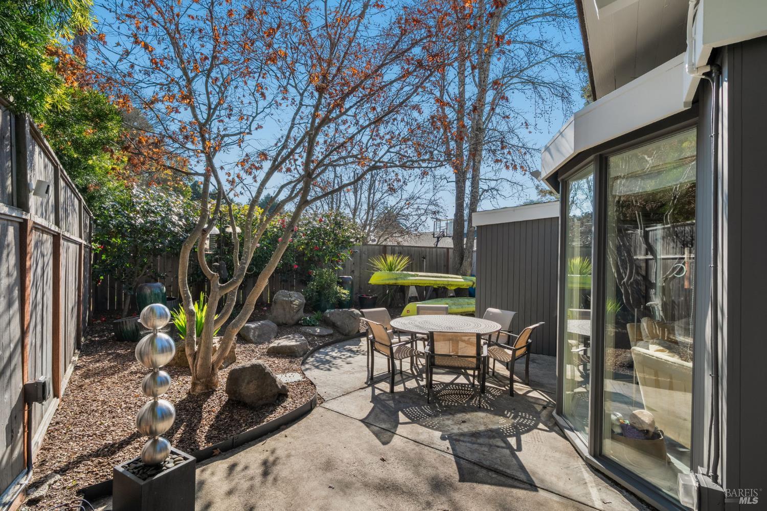 43 La Crescenta Way San Rafael, CA 94901 - Photo 28 of 28 a view of a house with backyard sitting area and garden