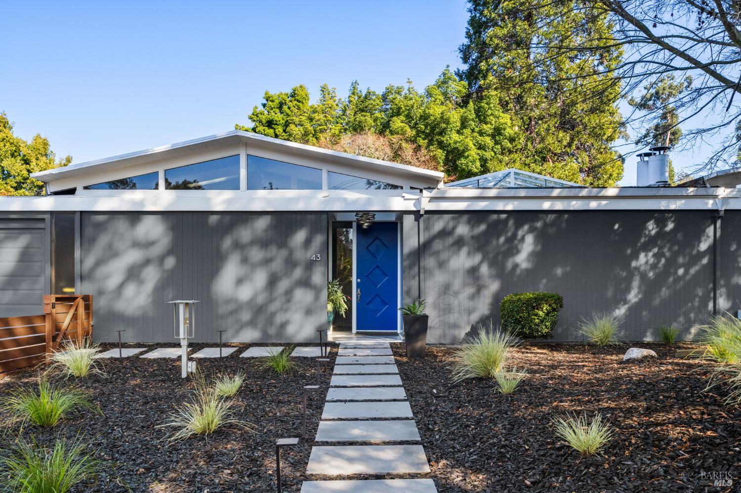 43 La Crescenta Way San Rafael, CA 94901 - Photo 3 of 28 a front view of a house with a yard
