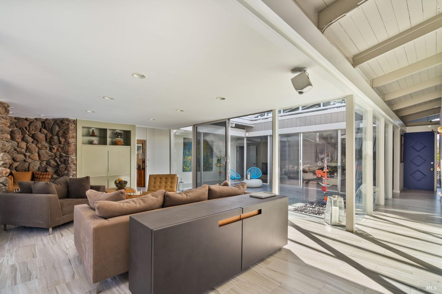 43 La Crescenta Way San Rafael, CA 94901 - Photo 9 of 28 a living room with furniture and large windows