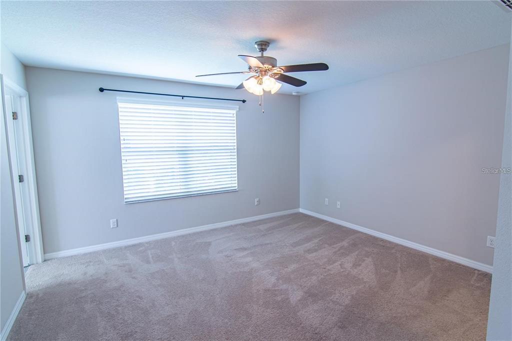 1977 Nature View Drive Lutz, FL 33558 - Photo 11 of 18 a view of a room with a ceiling fan and a window