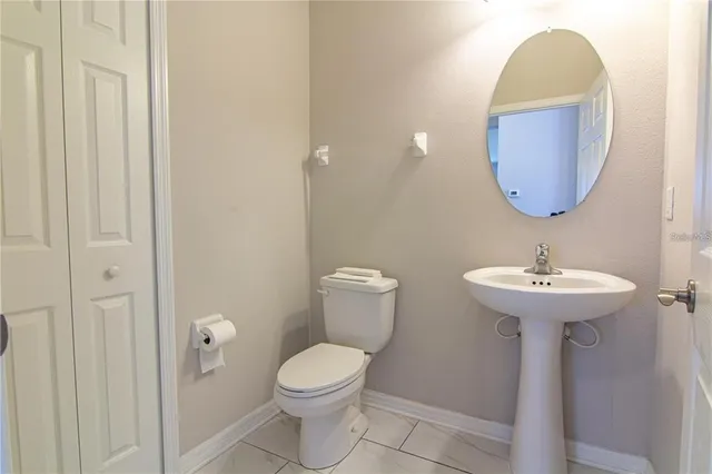 a bathroom with a toilet and a sink