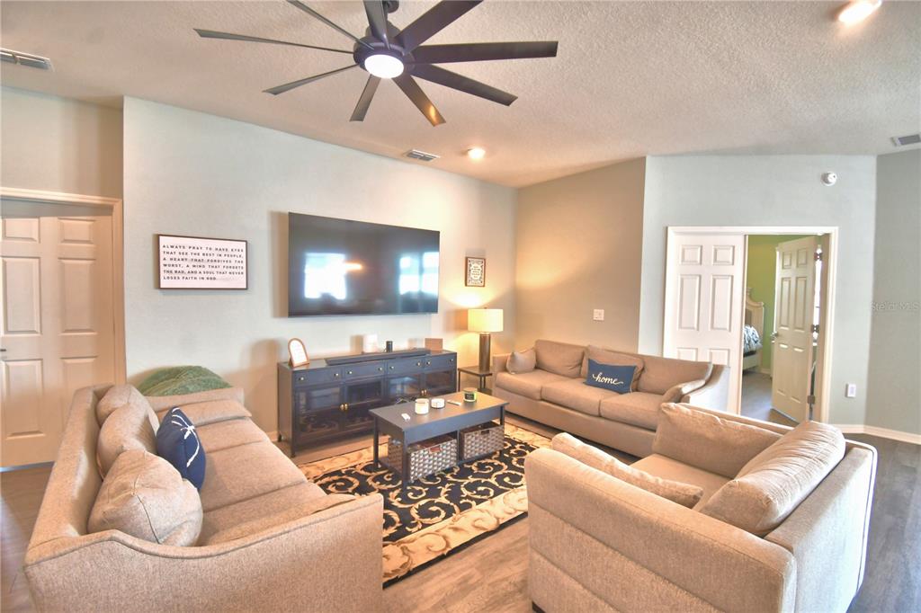 4340 Reding Way Lakeland, FL 33813 - Photo 13 of 63 a living room with furniture and a flat screen tv