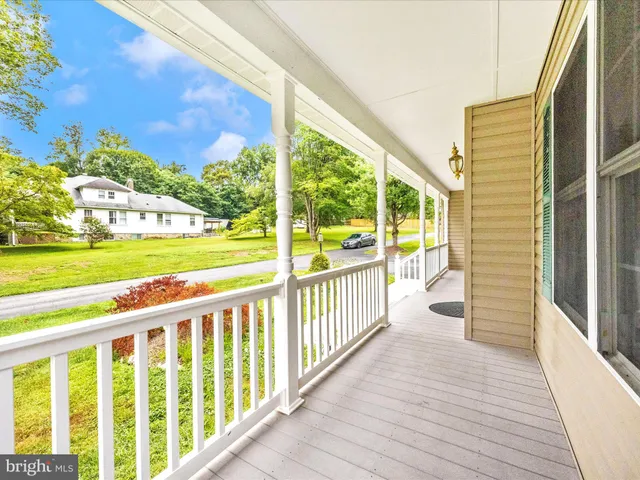 a view of a balcony with wooden floor