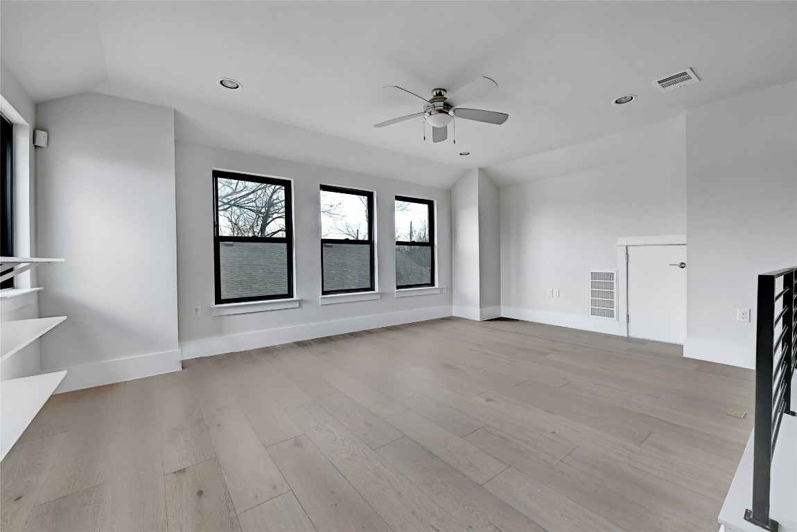 1815 West 38th Street Austin, TX 78731 - Photo 17 of 25 a view of an empty room with a window and wooden floor