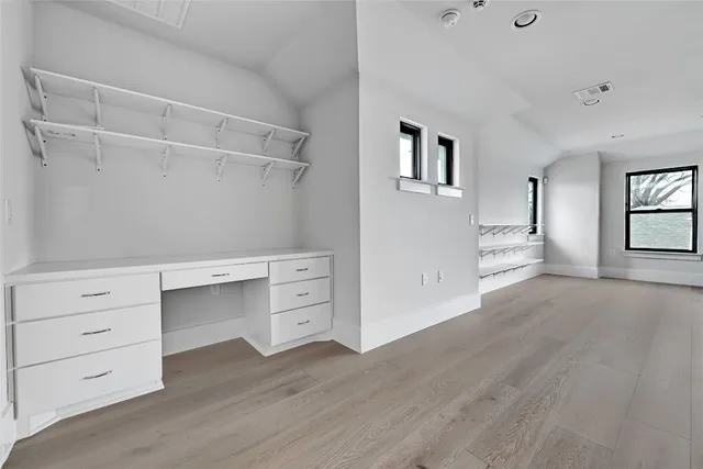 a view of an empty walk in closet