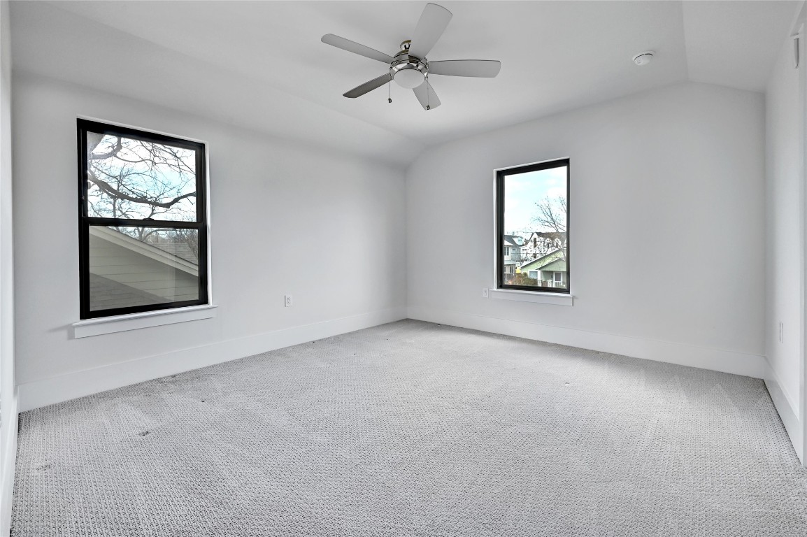 1815 West 38th Street Austin, TX 78731 - Photo 20 of 25 an empty room with windows and fan