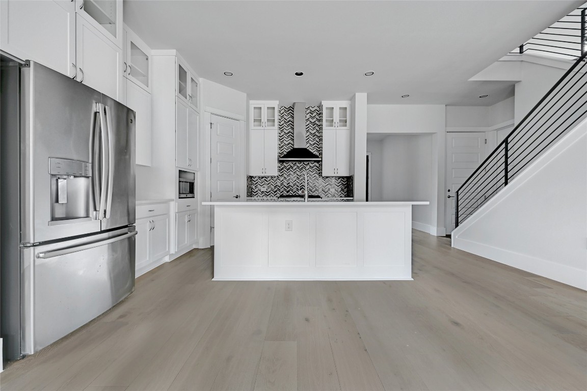 1815 West 38th Street Austin, TX 78731 - Photo 7 of 25 a large white kitchen with stainless steel appliances