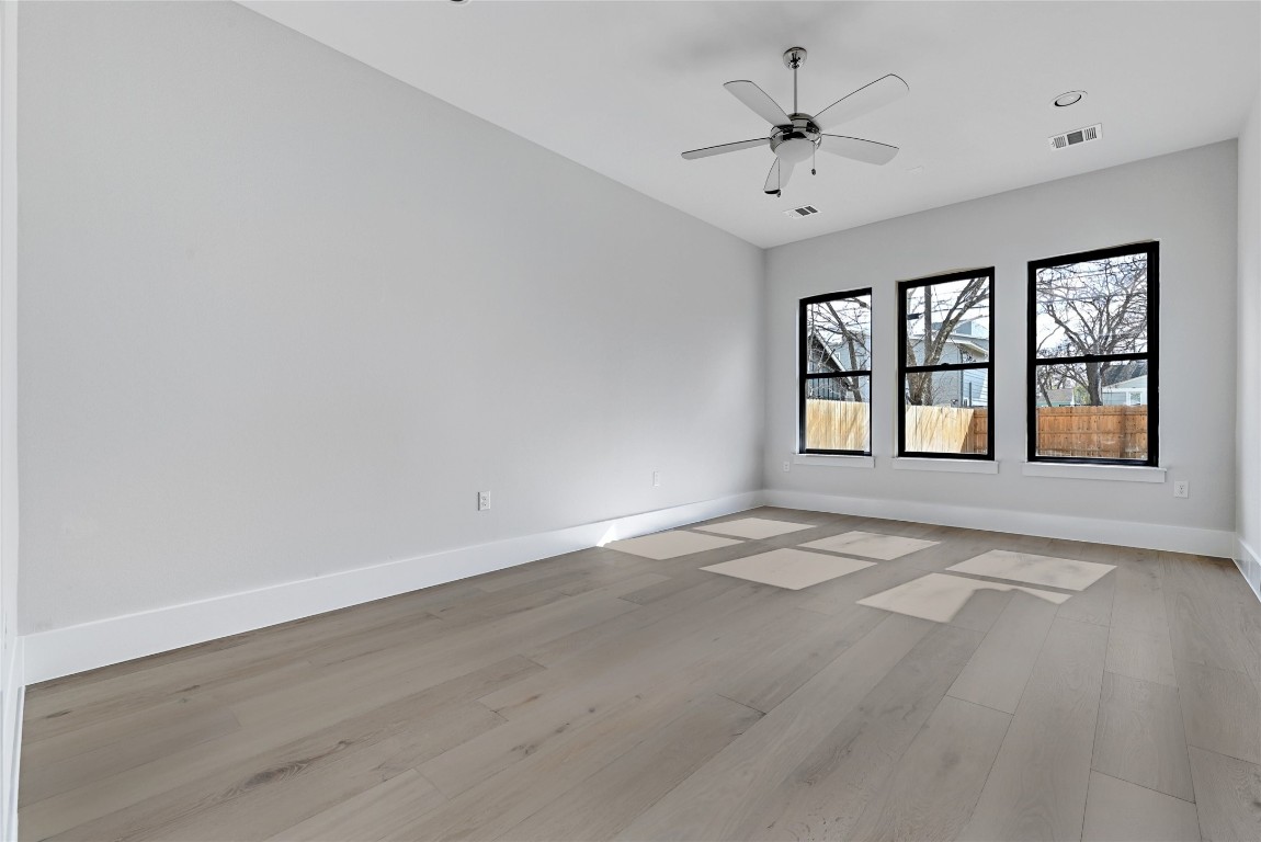 1815 West 38th Street Austin, TX 78731 - Photo 10 of 25 wooden floor in an empty room with a window