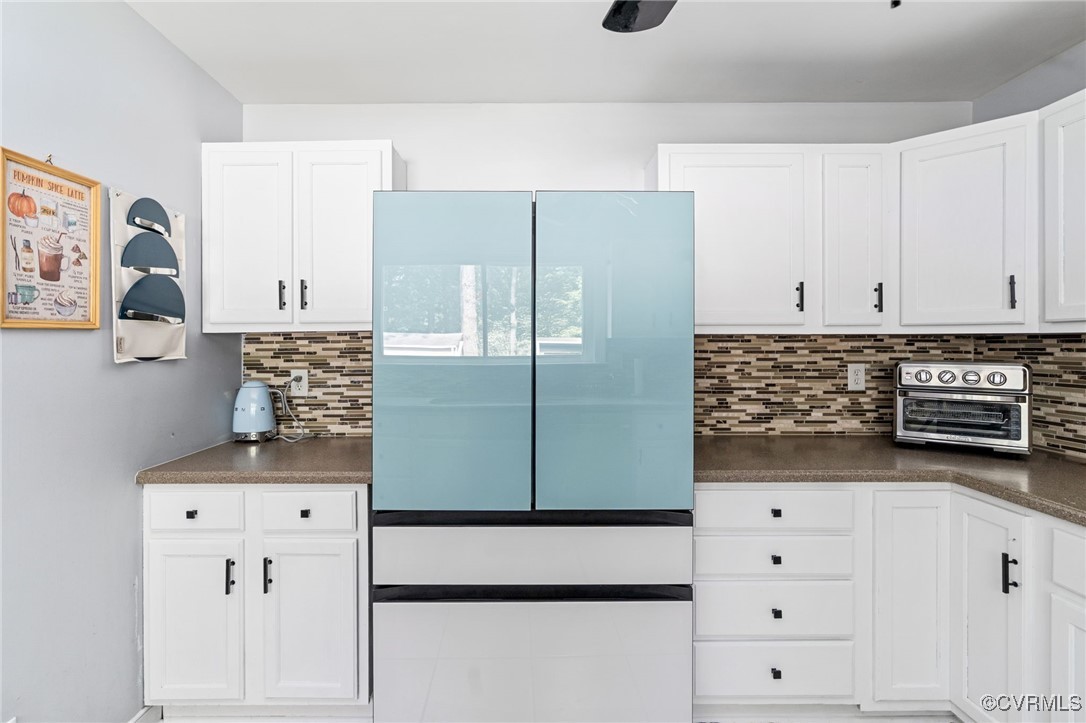 119 Monath Road Richmond, VA 23236 - Photo 12 of 48 a kitchen with cabinets and white appliances