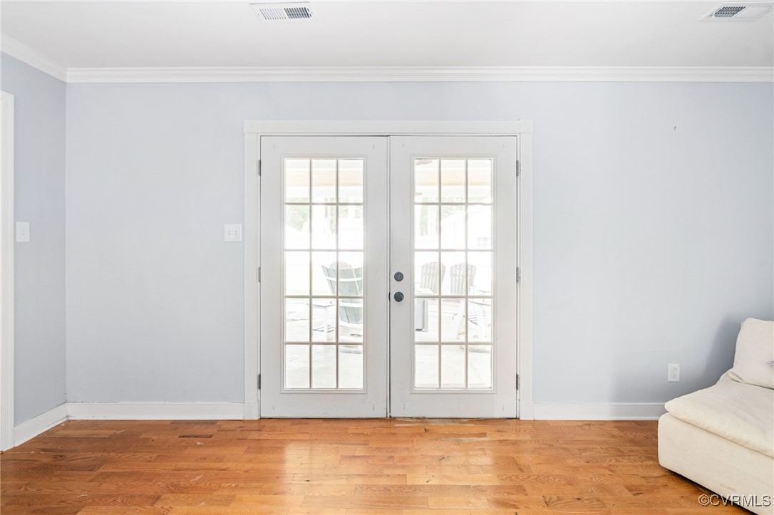 119 Monath Road Richmond, VA 23236 - Photo 26 of 48 a view of an empty room with wooden floor and a window