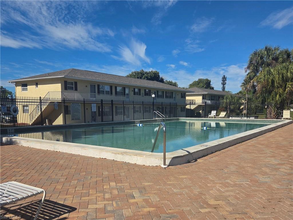 3325 Airport Road North, Unit G7 Naples, FL 34105 - Photo 11 of 13 a view of a house with a swimming pool