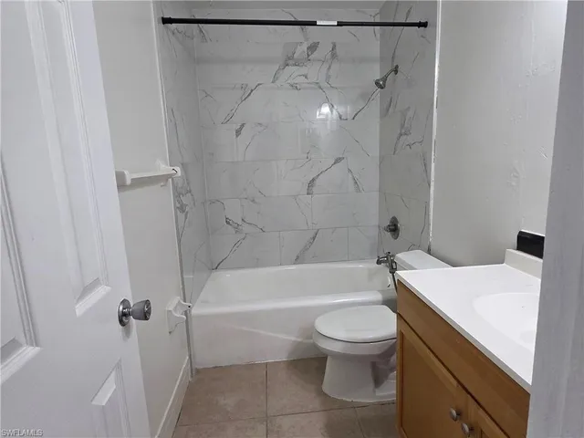 a bathroom with a sink a toilet and a bathtub