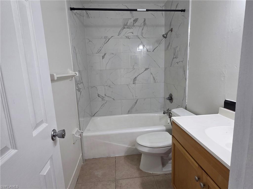 3325 Airport Road North, Unit G7 Naples, FL 34105 - Photo 5 of 13 a bathroom with a sink a toilet and a bathtub