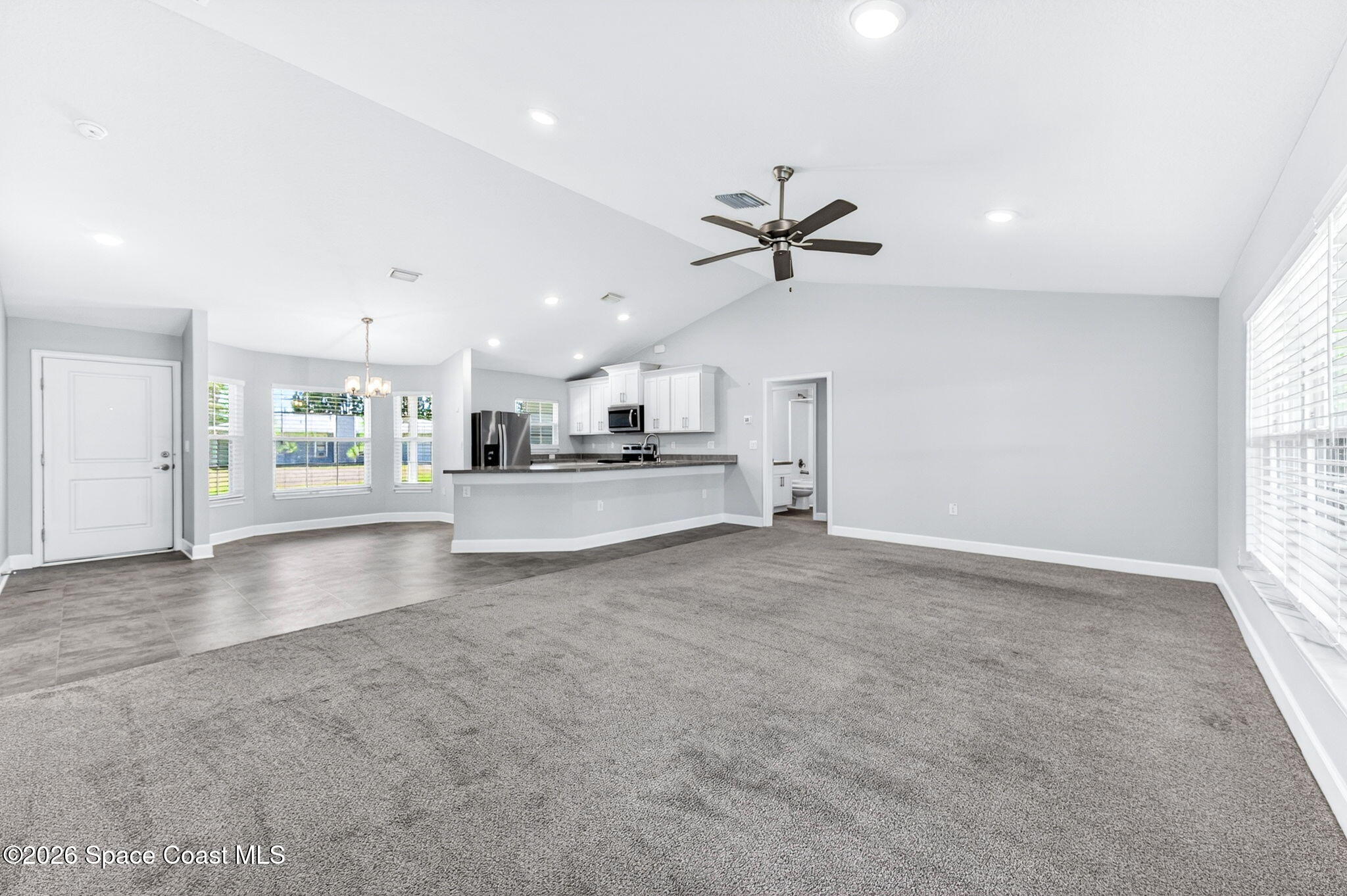717 Gelaso Street Southwest Palm Bay, FL 32908 - Photo 17 of 48 a view of a kitchen with a sink and a stove top oven