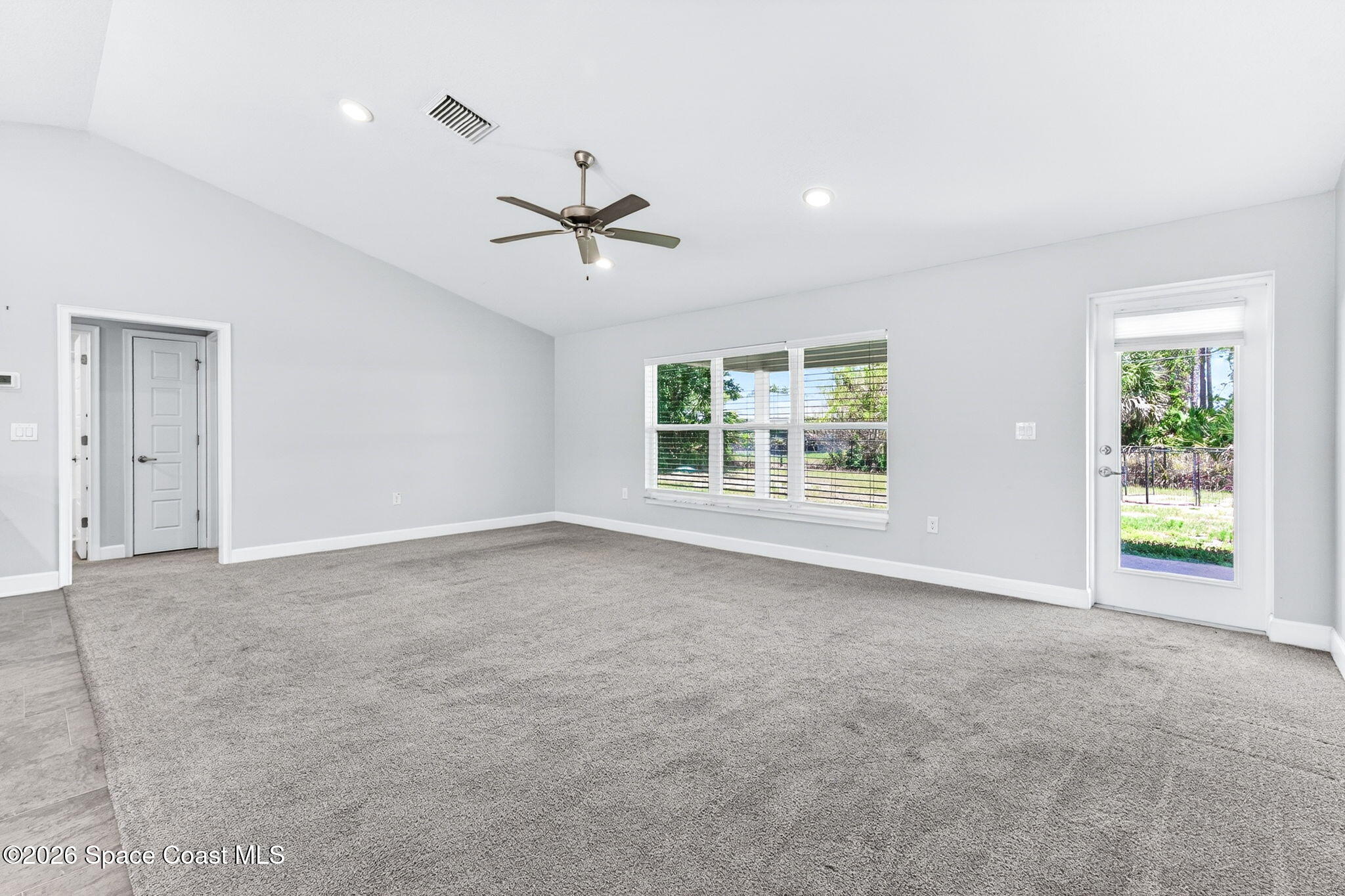 717 Gelaso Street Southwest Palm Bay, FL 32908 - Photo 18 of 48 a view of an empty room with a window
