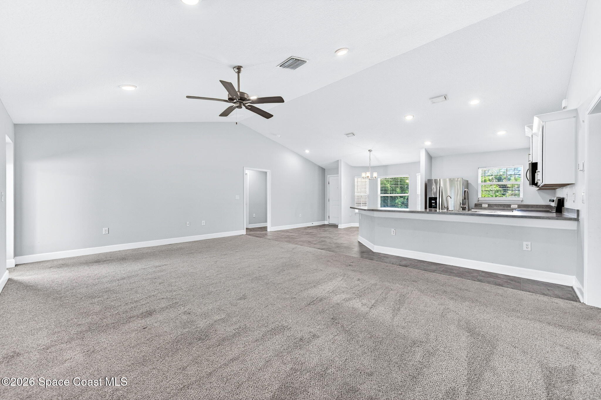 717 Gelaso Street Southwest Palm Bay, FL 32908 - Photo 19 of 48 an empty room with a ceiling fan and a ceiling fan