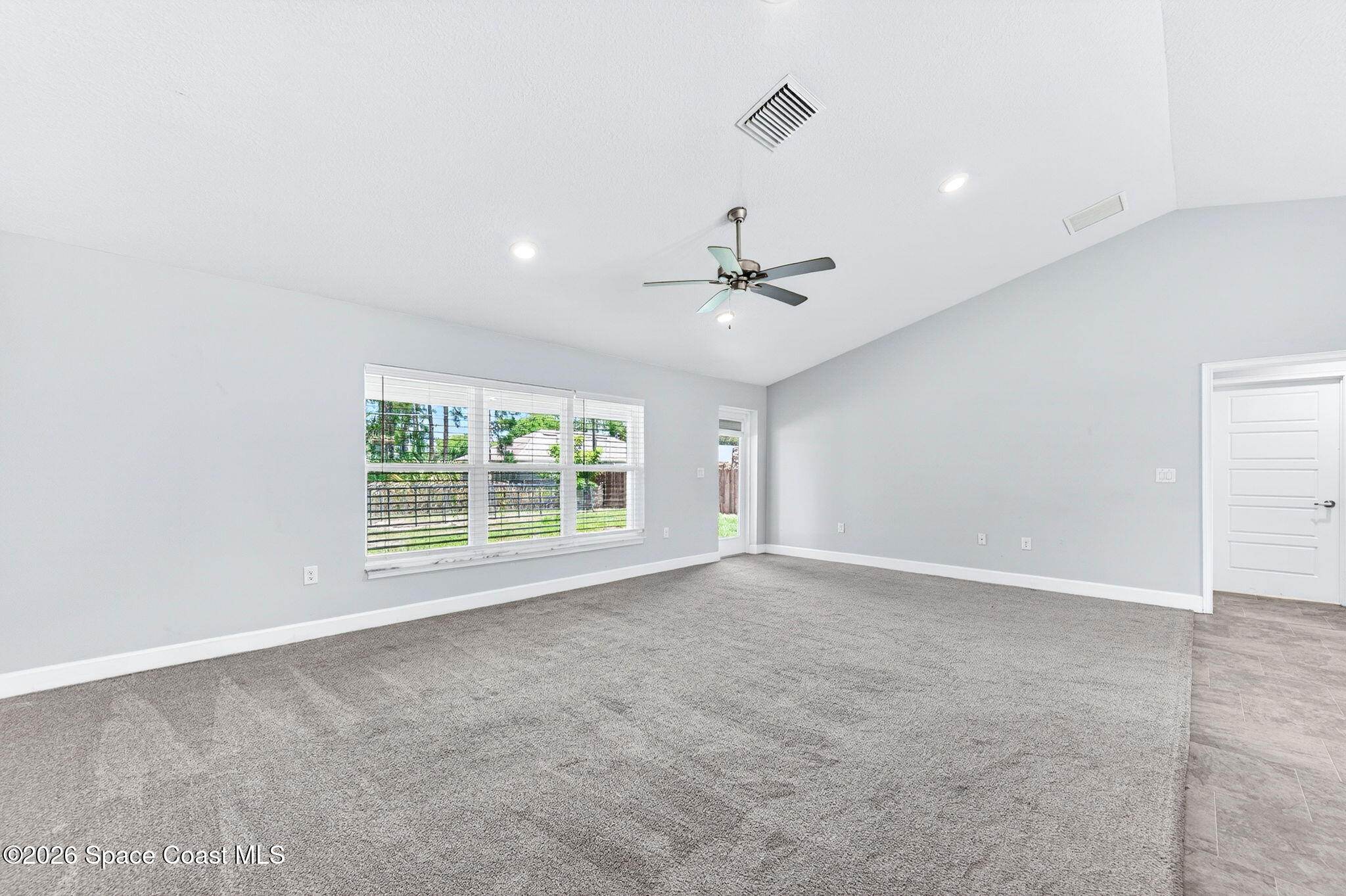 717 Gelaso Street Southwest Palm Bay, FL 32908 - Photo 20 of 48 a view of an empty room with a window