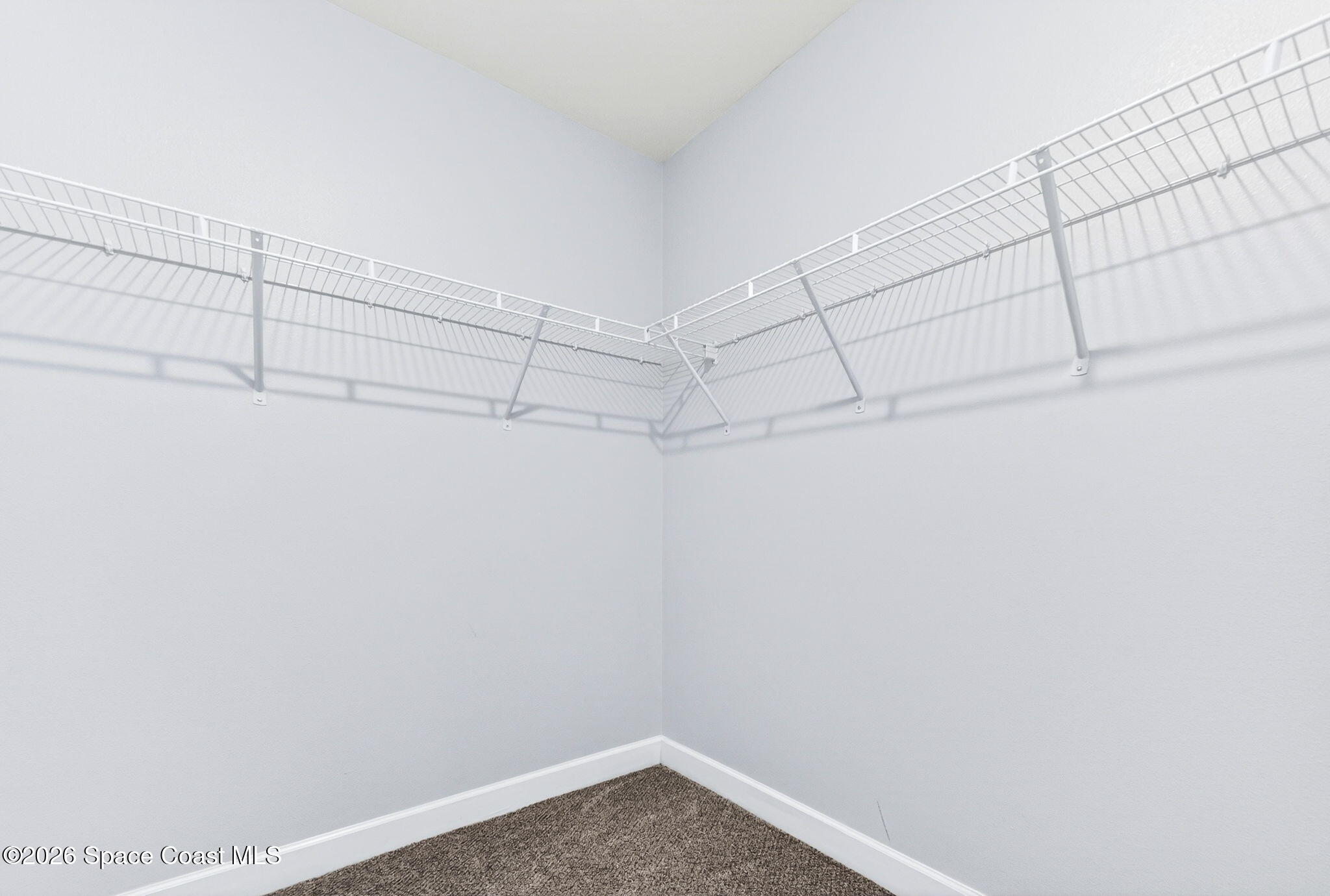 717 Gelaso Street Southwest Palm Bay, FL 32908 - Photo 26 of 48 a view of a room with racks on the wall