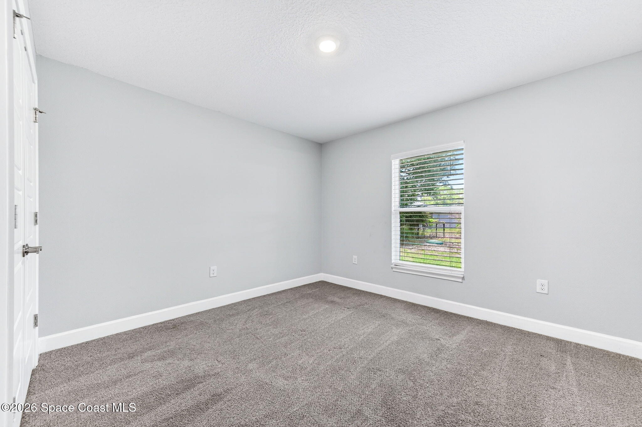717 Gelaso Street Southwest Palm Bay, FL 32908 - Photo 27 of 48 an empty room with a window