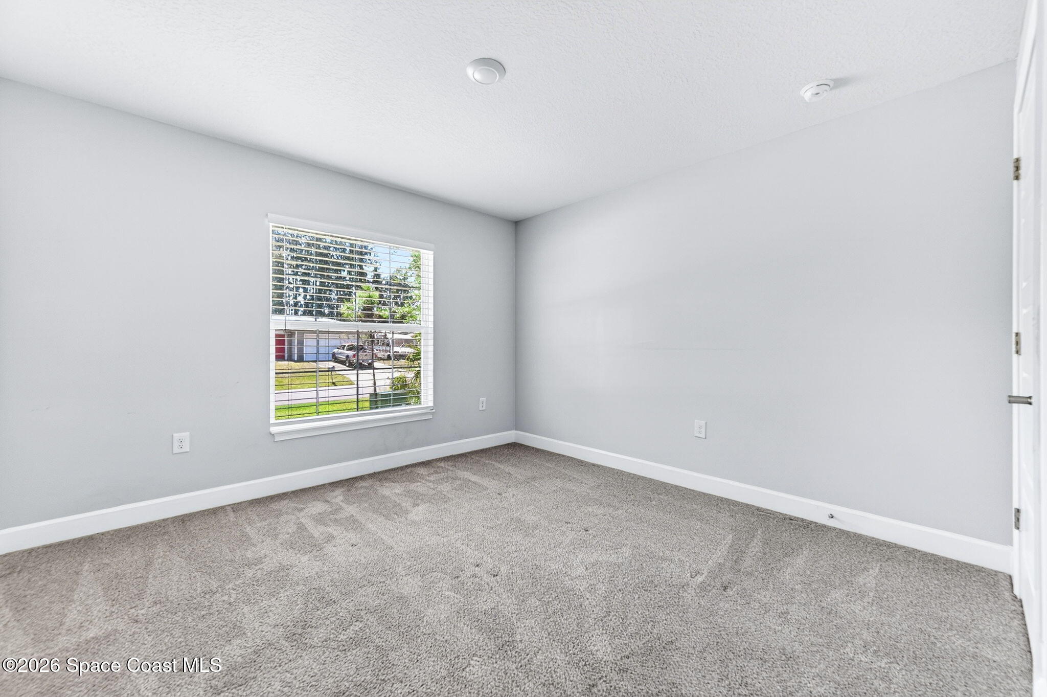 717 Gelaso Street Southwest Palm Bay, FL 32908 - Photo 30 of 48 an empty room with a window