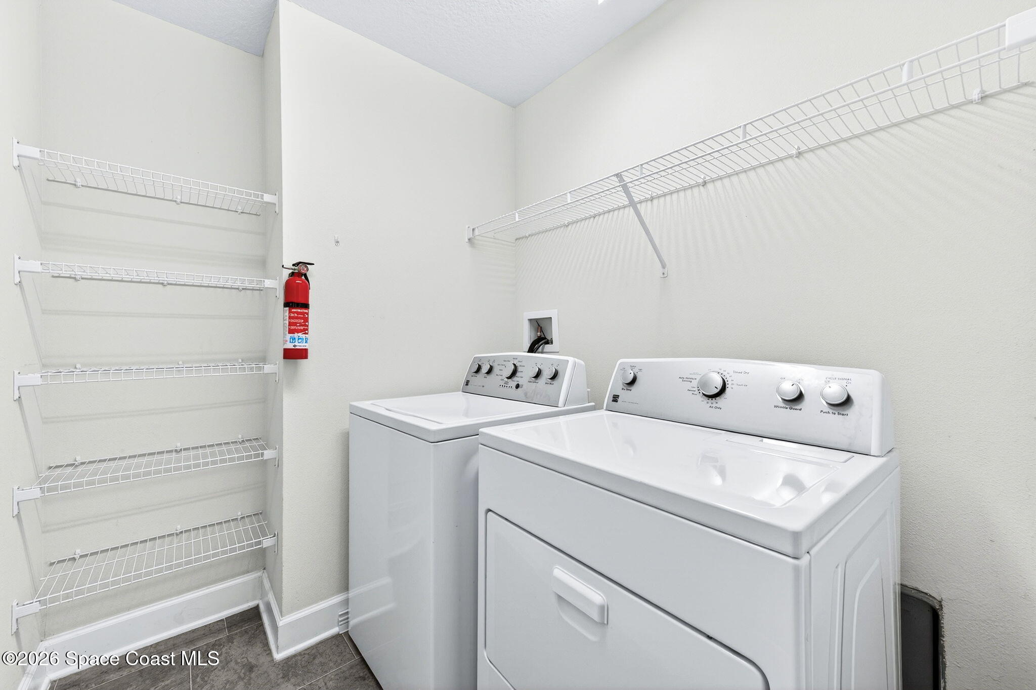 717 Gelaso Street Southwest Palm Bay, FL 32908 - Photo 33 of 48 a utility room with dryer and washer