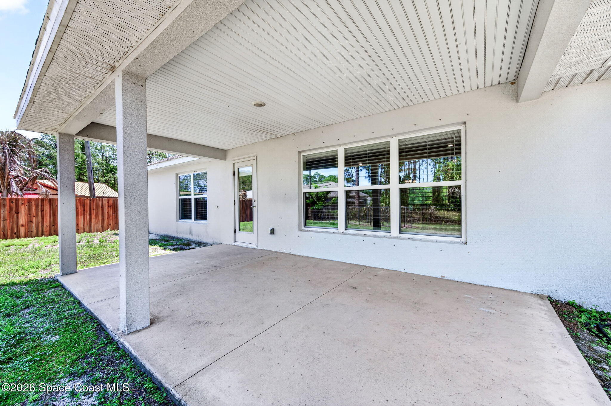 717 Gelaso Street Southwest Palm Bay, FL 32908 - Photo 36 of 48 a view of a porch with furniture and garden