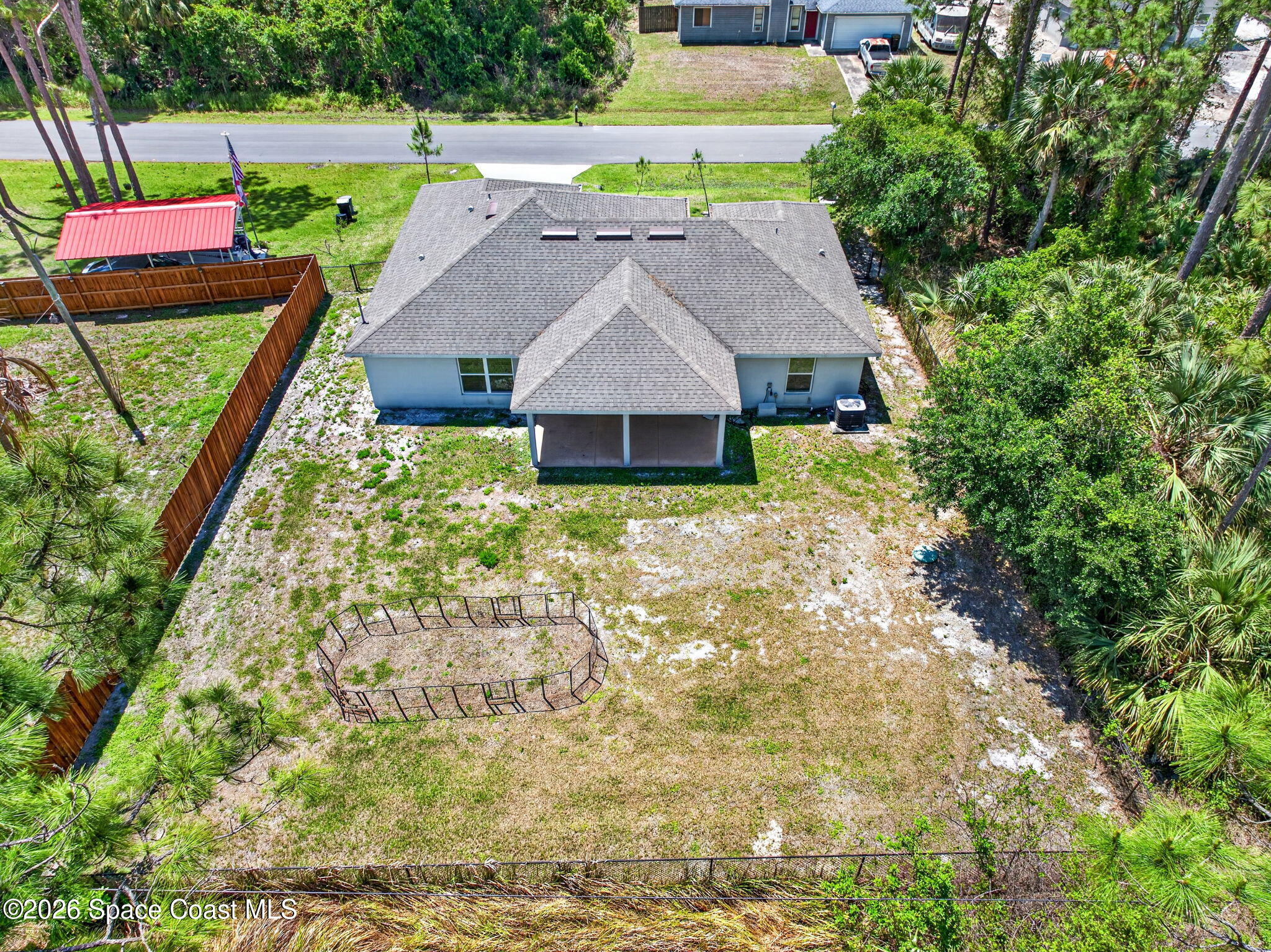 717 Gelaso Street Southwest Palm Bay, FL 32908 - Photo 4 of 48 a aerial view of a house with a yard