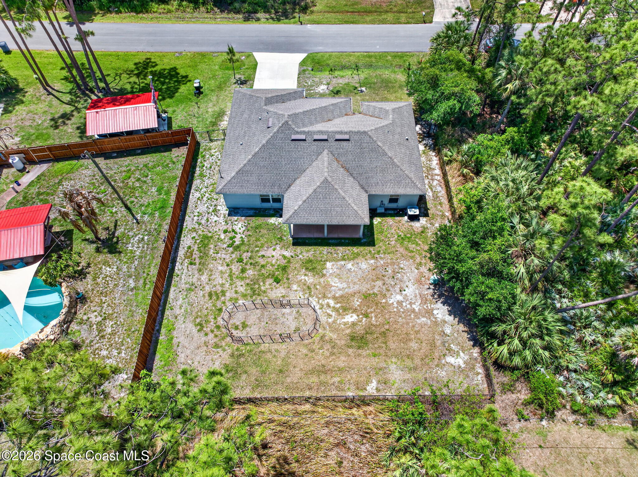 717 Gelaso Street Southwest Palm Bay, FL 32908 - Photo 41 of 48 an aerial view of a house with garden space and sitting area