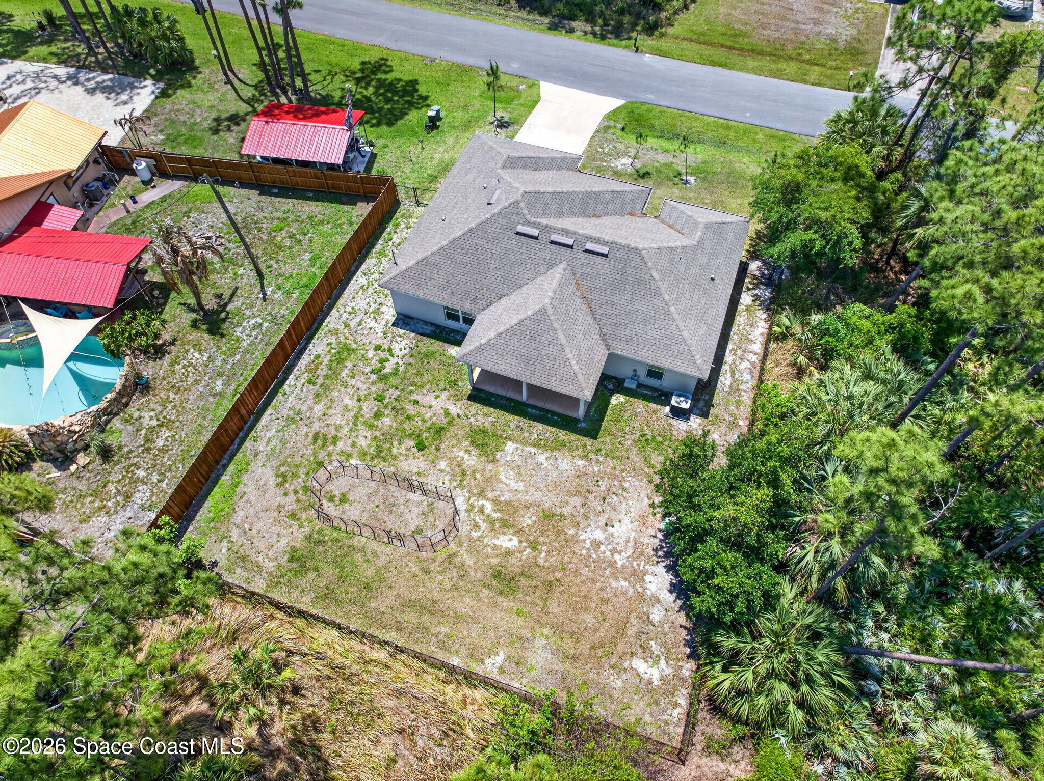 717 Gelaso Street Southwest Palm Bay, FL 32908 - Photo 42 of 48 an aerial view of a house with a yard