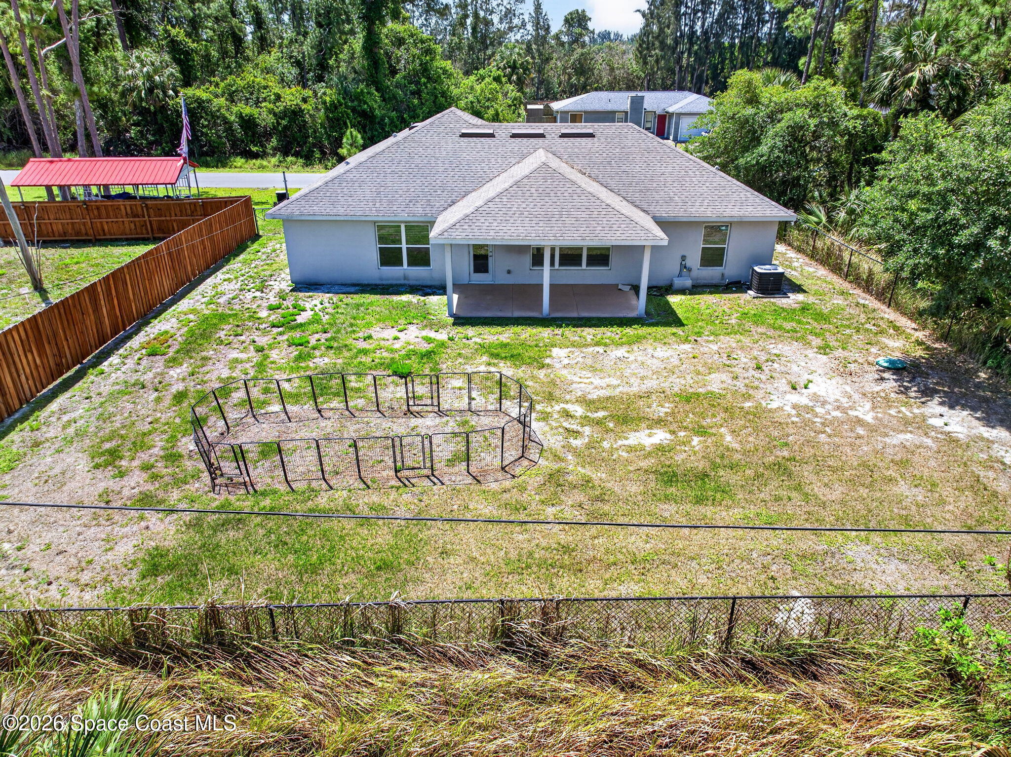 717 Gelaso Street Southwest Palm Bay, FL 32908 - Photo 43 of 48 a view of a house with a yard