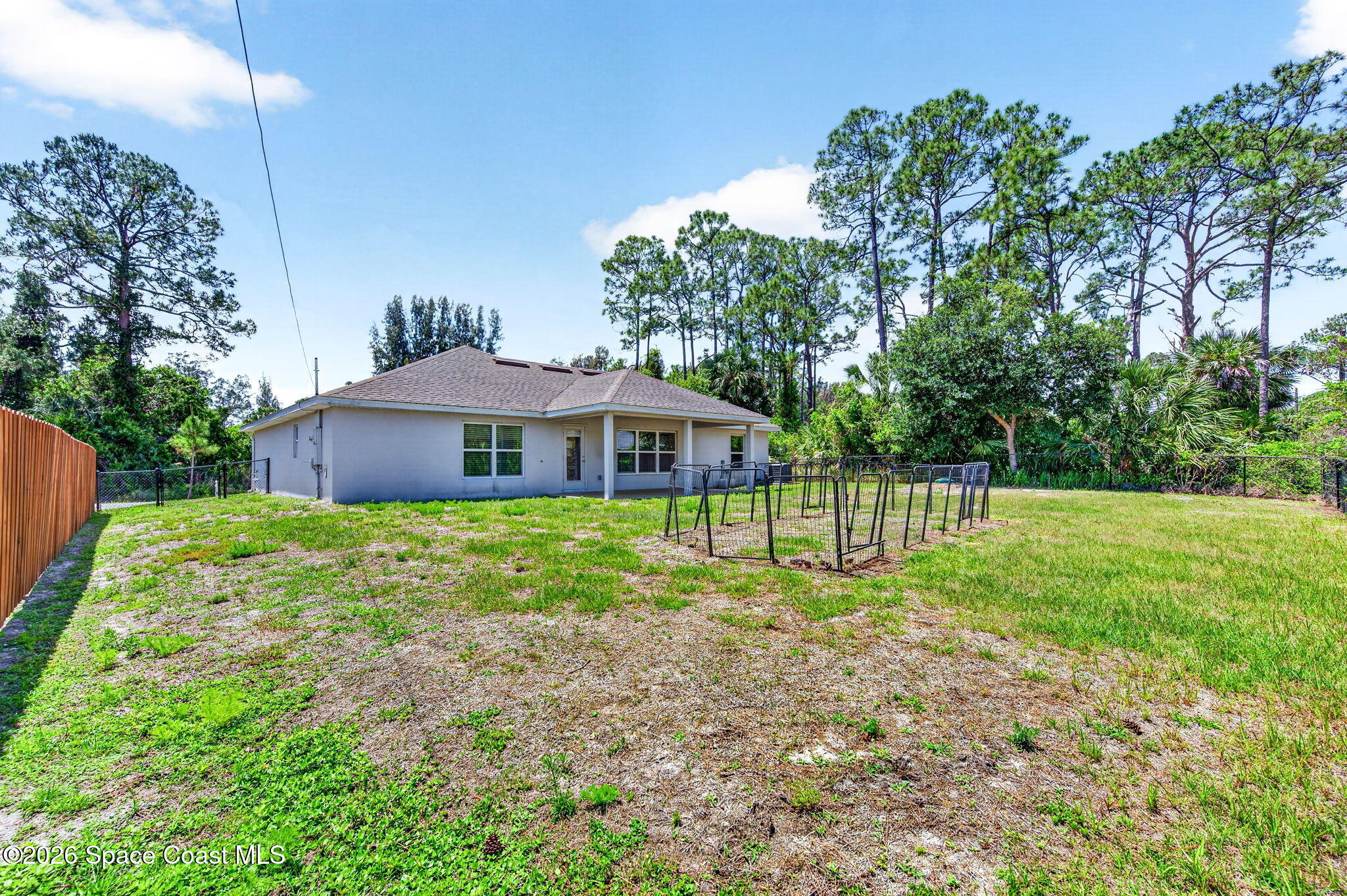 717 Gelaso Street Southwest Palm Bay, FL 32908 - Photo 45 of 48 a front view of a house with a yard