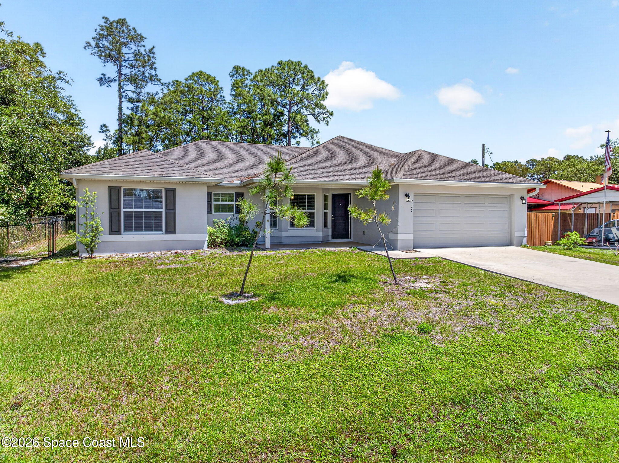717 Gelaso Street Southwest Palm Bay, FL 32908 - Photo 47 of 48 a house view with a garden space