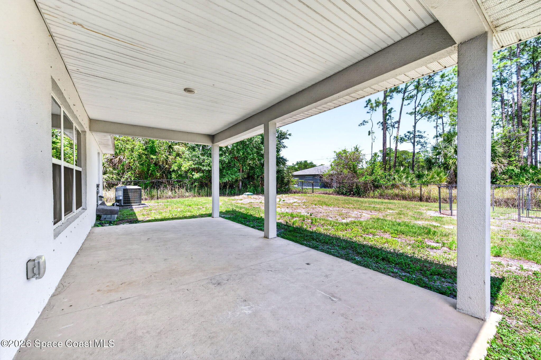 717 Gelaso Street Southwest Palm Bay, FL 32908 - Photo 6 of 48 a view of a house with backyard and porch