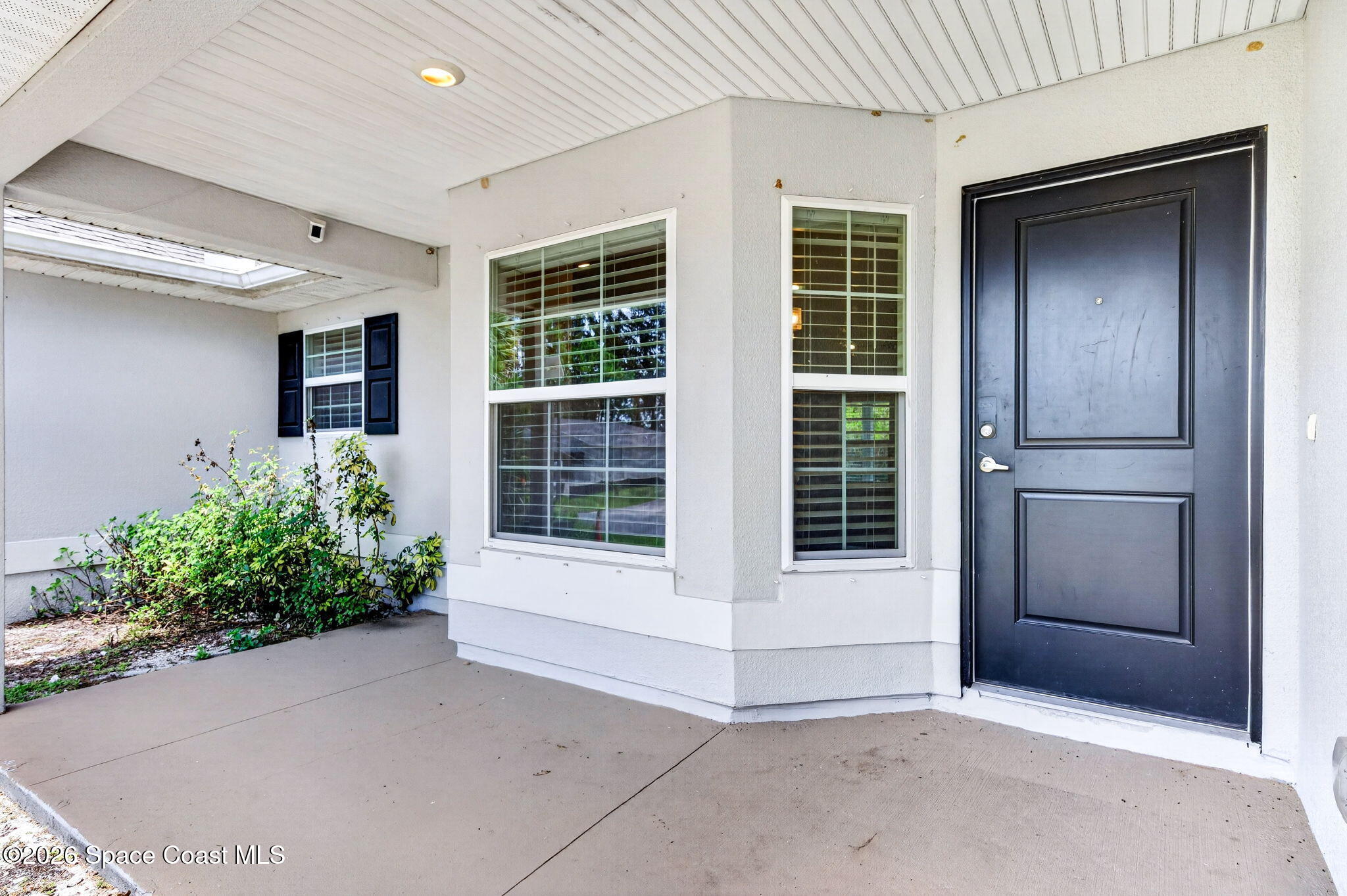 717 Gelaso Street Southwest Palm Bay, FL 32908 - Photo 10 of 48 a view of a entryway door of the house