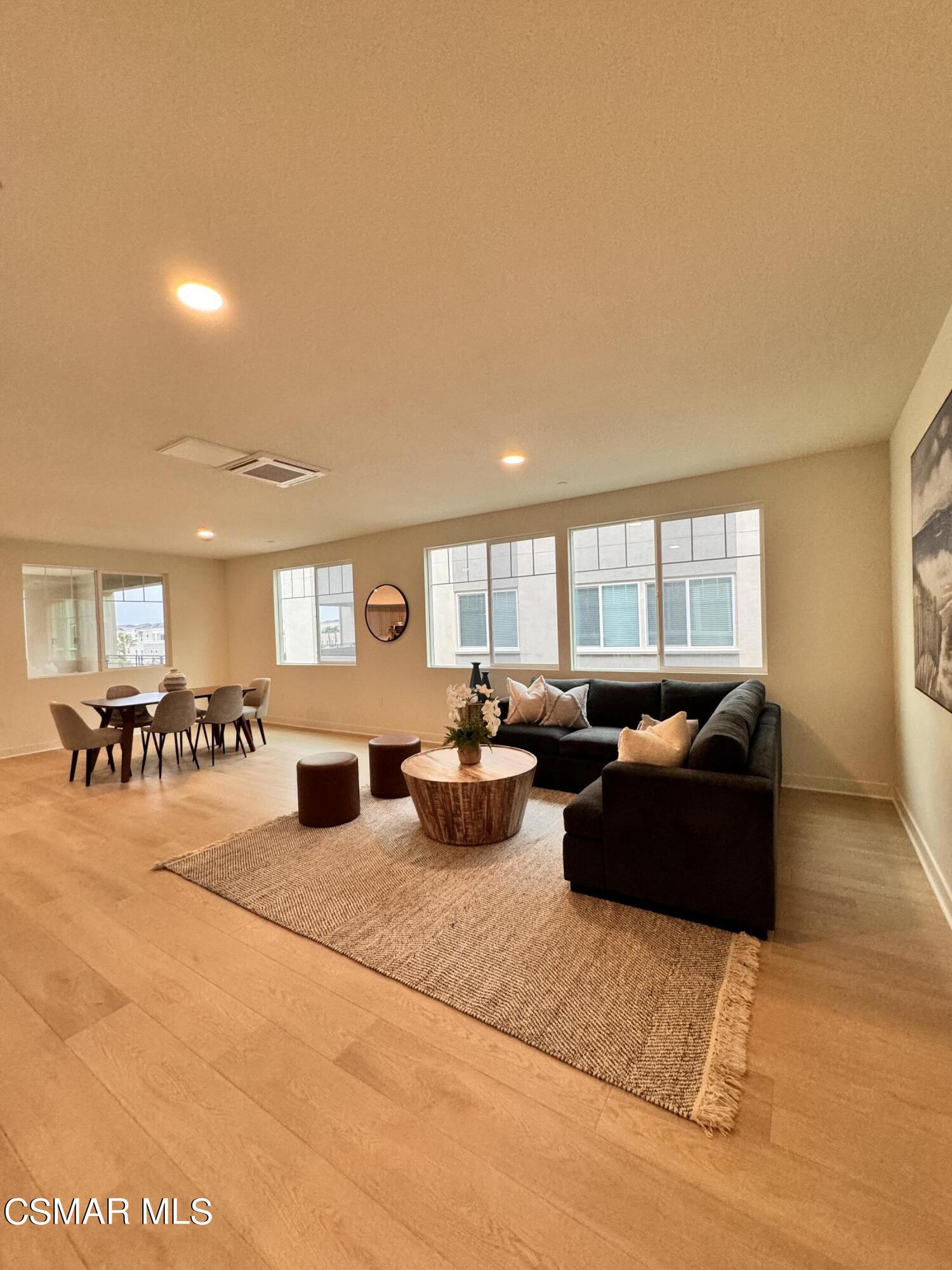 2850 Wagon Wheel Road, Unit 303 Oxnard, CA 93036 - Photo 15 of 42 a living room with furniture and a table