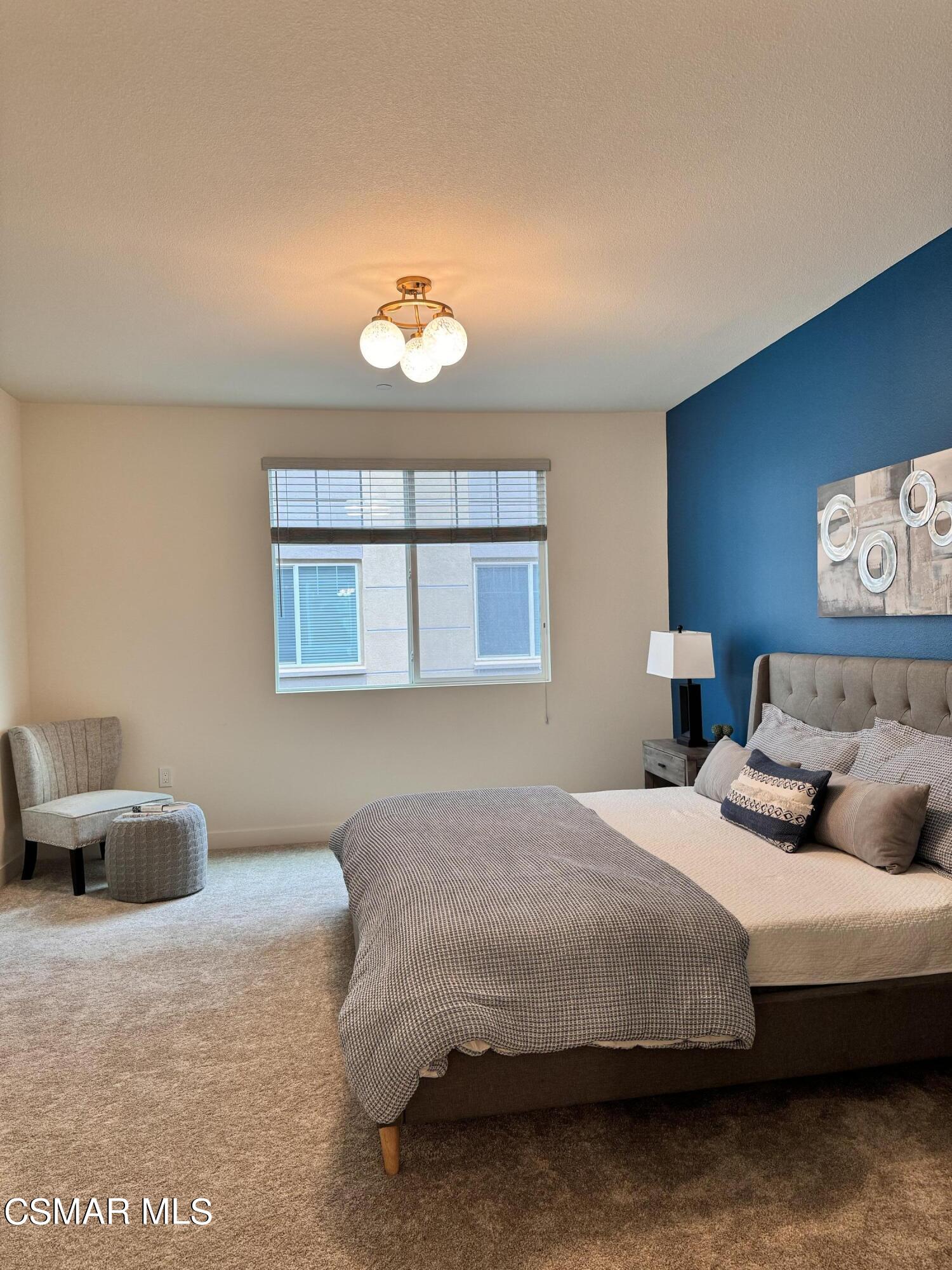 2850 Wagon Wheel Road, Unit 303 Oxnard, CA 93036 - Photo 18 of 42 a bedroom with bed and window