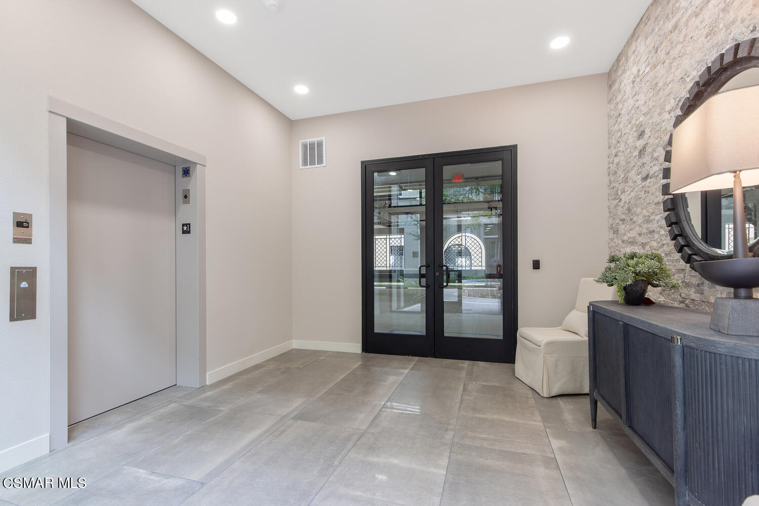 2850 Wagon Wheel Road, Unit 303 Oxnard, CA 93036 - Photo 2 of 42 a view of a hallway and a livingroom with furniture
