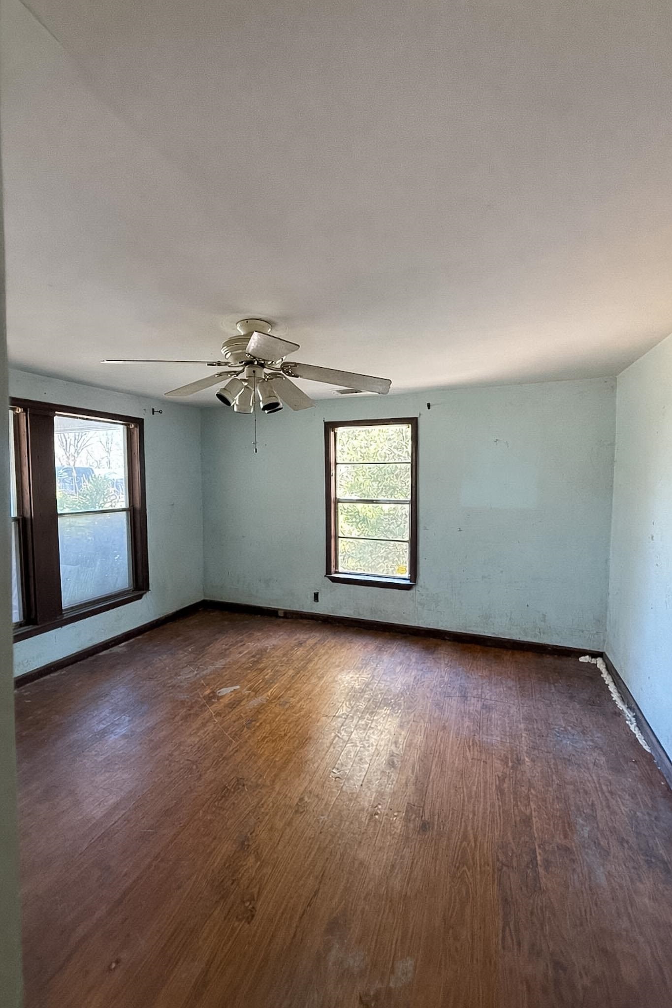 7394 Benjestown Road Millington, TN 38053 - Photo 2 of 6 Unfurnished room featuring dark wood-style flooring and ceiling fan