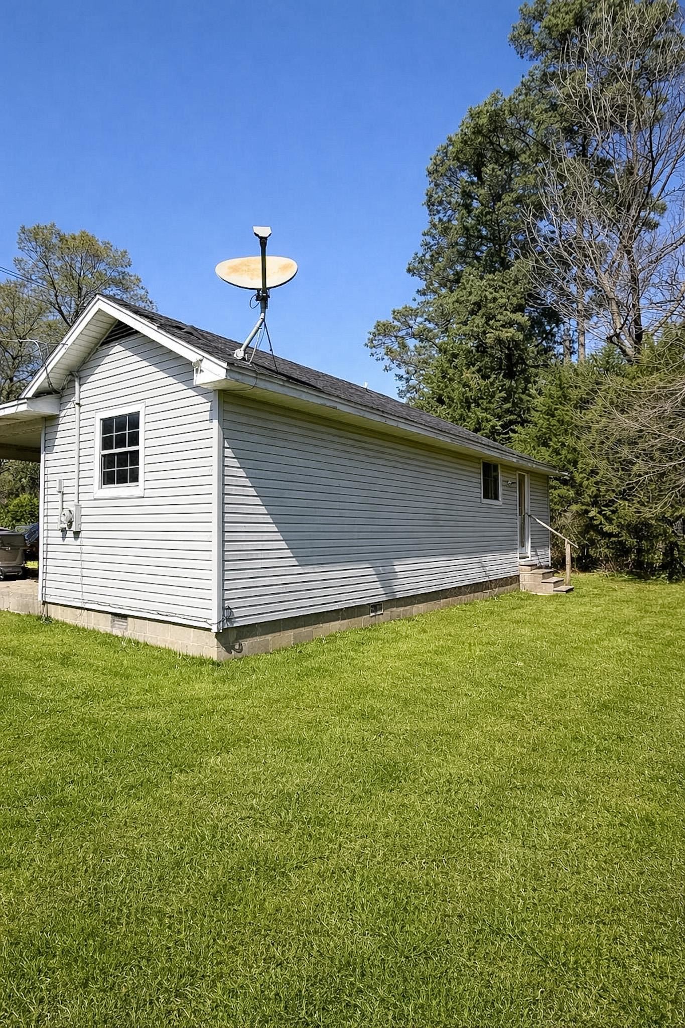 7394 Benjestown Road Millington, TN 38053 - Photo 6 of 6 View of side of property with crawl space and a lawn