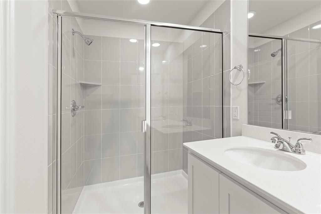5414 East Runnel Road Royse City, TX 75189 - Photo 21 of 26 a bathroom with a granite countertop shower sink and mirror