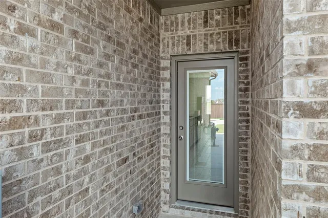 a bathroom with a shower and a mirror